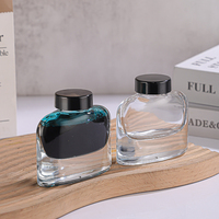 Bouteille d'encre vide en verre transparente carrée et plate de 50ml au design de haute qualité personnalisée avec couvercle en plastique noir, vente en gros