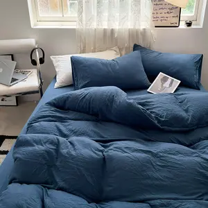 Vente en gros d'ensembles de lit en coton lavé 4pcs ensemble de literie à bas prix drap de lit d'hôtel couleur unie ensemble de draps de lit