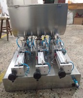 Machine de remplissage pneumatique semi-automatique à double tête pour boissons, huiles et matériaux à grosses particules, compatible avec les sachets/sacs