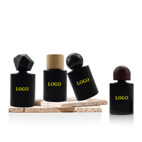 Emballage de bouteille de parfum de jet de cylindre du noir mat 50ml de style simple de luxe avec le couvercle et la boîte