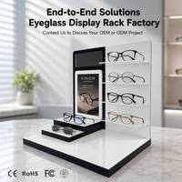 Présentoir à lunettes moderne personnalisé noir et blanc multi-zones en acrylique avec miroir intégré pour essayage et panneau d'affichage interchangeable