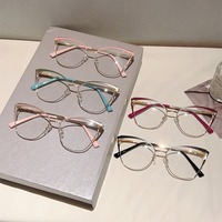 91258 Lunettes anti-lumière bleue œil de chat bicolores pour femme avec charnière à ressort et branches tendance