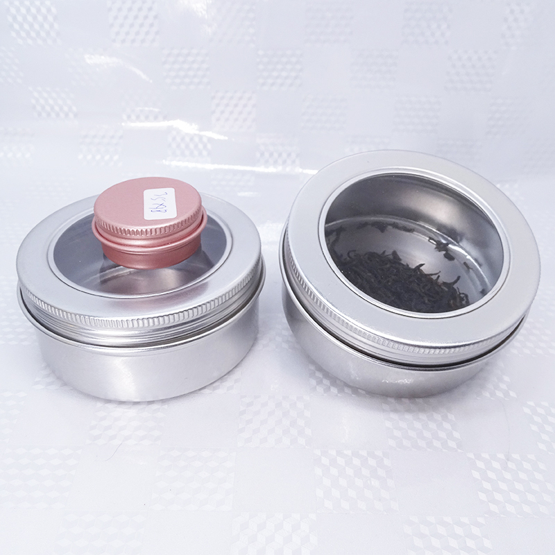 Серебристая металлическая жестяная чайная банка с широким горлышком и прозрачной крышкой