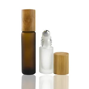 Sıcak satış 5ml 10ml rolon şişe bambu kapaklı silindir topu cam şişe uçucu yağlar için mat buzlu cam silindir şişe 15ml