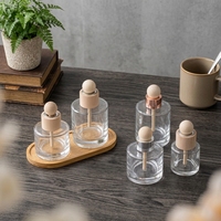 Bouteilles diffuseurs à roseaux en verre transparent de 50 ml en gros avec bouchons en bois, surface givrée, imprimées, vides, pour huiles essentielles, parfums et décoration intérieure