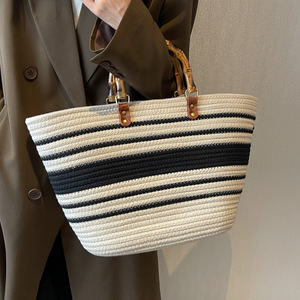 Stylish and trendy Korean-style woven tote <b>bag</b> with <b>patchwork</b> shoulder design, large capacity, and bamboo handle. - Product Image 1