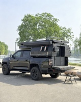 Mini-caravane pliante Pioneer en aluminium léger avec capacité pour 4 personnes et équipement de cuisine