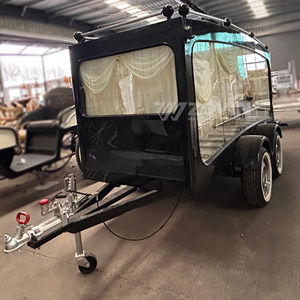 รถศพไฟฟ้าสีดำพร้อมผ้าม่านสีครีมและโครงเหล็ก ยานพาหนะขนส่งพิเศษ - Product Image 2