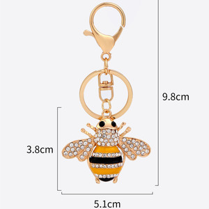Lindo colgante de abeja esmaltada con alas e incrustaciones de diamantes de imitación, diseño de cuerpo con rayas negras, amarillas o arcoíris, y anillo de llavero resistente. - Product Image 2