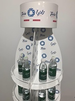 Mettez le présentoir de canettes de boisson d'eau en bouteille 4 niveaux rotatifs à 360 degrés avec des roues mettant l'acrylique en métal combinent le blanc