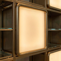 Vitrine de présentation de lunettes de luxe en or champagne, niche murale rétroéclairée, îlot tour rond, mobilier pour magasin de lunettes et boutique d'optique