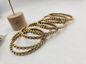 Traditional gold-plated daily wear <b>bangles</b> featuring a sleek circular design adorned with white stones <b>set</b> - Product Image 3