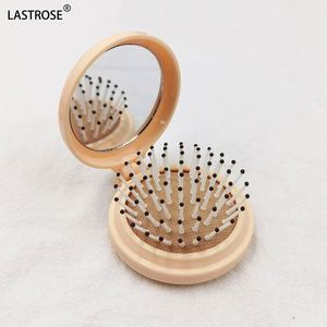 กระจกพกพาแบบพับได้ OEM รุ่นมินิ ทรงกลม ทำจากพลาสติก พร้อมหวีแปรงผมแบบลม - Product Image 5