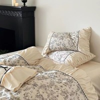 Ensemble de literie 6 pièces en polyester noir et blanc imprimé avec dentelle et nœuds, comprenant housse de couette, drap plat et drap-housse