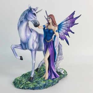 Estatua de Resina Decorativa para el Hogar de una Hada y un Unicornio - Product Image 1