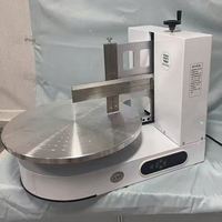 Machine à gâteaux automatique électrique durable pour le glaçage et le revêtement, idéale pour la pâtisserie et la préparation de snacks