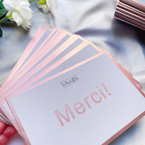 การ์ดขอบคุณแบบฝรั่งเศส Merci แบบกำหนดเอง ขอบฟอยล์สีโรสโกลด์ ปั๊มโลโก้ด้วยความร้อน การ์ดอวยพรกระดาษสีขาวสำหรับธุรกิจขนาดเล็ก - Product Image 1