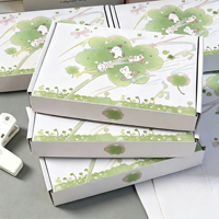 Boîte d'expédition portable en carton ondulé motif chien de dessin animé trèfle vert, écologique et réutilisable, gaufrage tendance pour cadeaux et bijoux