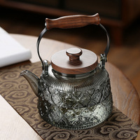 Théière en verre à haute teneur en borosilicate de style nouveau poignée noire transparente bégonia intégrée gris fumée pour bouilloire à thé bouillante à la vapeur