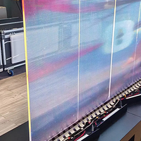Fenêtre en verre de publicité de film LED d'affichage de module de maille transparente HD superbe mince pour l'utilisation d'ascenseur dans les magasins de détail de centres commerciaux