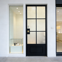 Puerta francesa de aluminio con rejilla hueca y vidrio esmerilado degradado para estudio privado