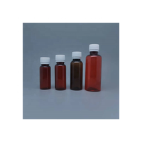 Bouteille de liquide PET ambré vide de 60ml 60cc 2oz avec sérigraphie pour emballage pharmaceutique avec tasse à mesurer