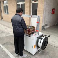 Machine d'emballage automatique de ruban PP de table, machine à cerclage automatique de boîtes en carton ondulé