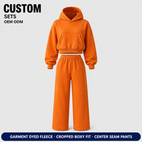 Ensemble deux pièces personnalisé orange pour homme : sweat à capuche épais surdimensionné avec poche kangourou et pantalon de survêtement large délavé pour le streetwear