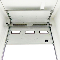 Portes de garage basculantes automatiques en acier de style moderne de haute qualité installées pour les hôtels d'atelier d'entrepôt et les surfaces finies