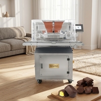 Machine à déposer le chocolat pour la production de barres chocolatées fourrées, de pralines et de bonbons