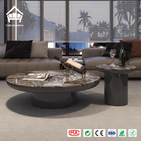 Table basse moderne en marbre rond avec base en piédestal noir, table centrale personnalisée, solution tout-en-un pour le mobilier de salon