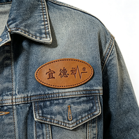 Étiquette en cuir véritable avec logo de marque personnalisé en gros pour le branding des jeans, vestes en denim et casquettes de camionneur en maille
