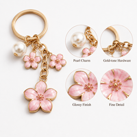 Llavero de aleación de zinc con flor de cerezo esmaltada, dulce y lindo, con perlas, para bolso, mochila, cartera o teléfono