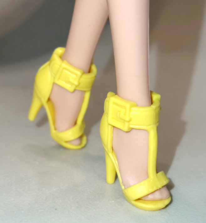 Lemon yellow-shoes worn by petite barbie doll as picture