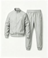 Ensemble de survêtement en nylon basique sur mesure OEM pour hommes, coupe classique, avec broderie de logo, poignets élastiqués imperméables, survêtement deux pièces