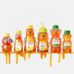 Venta al por mayor de botellas de plástico para embalaje de miel PET botella exprimible para miel oso botella exprimible