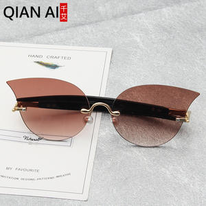Lunettes de soleil œil de chat Qianai pour femme, verres jaunes océan, protection UV 100%, design irrégulier tendance pour la protection solaire et les voyages - Product Image 1