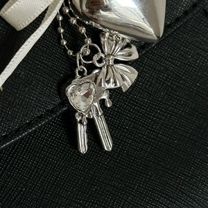 Estilo coreano diseño de nicho marco de fotos llavero de Metal plata amor arco bolsa colgante estilo Ins - Product Image 6