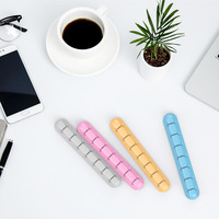 Enrouleur de support de câble de gestion de paquet d'organisateur de cordon de câble de bureau adhésif en silicone pour organiser le câble USB/cordon d'alimentation/fil