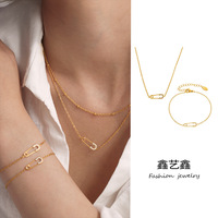 Ensemble collier et bracelet en zircon avec pendentif en acier inoxydable en forme de trombone