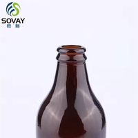 Botol kaca minuman Amber tebal bulat kustom dengan tutup dalam berbagai ukuran botol bir