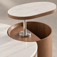 Table basse relevable WYRAX pour hall d'hôtel avec plateau supérieur surélevé, plateau latéral ouvert et base de rangement incurvée