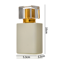 Flacon de parfum en verre transparent bleu carré vide de 35 ml avec bouchon à vis, emballé dans un carton