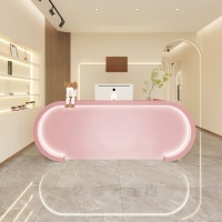 Comptoir de réception moderne rose en bois massif avec éclairage LED à deux niveaux pour salon de beauté, magasin de vêtements, studio de danse