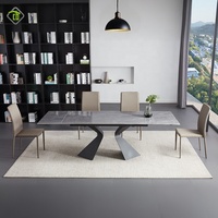 Table de salle à manger au design unique avec pieds en métal noir et plateau en céramique imitation marbre, idéale pour les restaurants modernes
