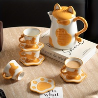 Service à thé en céramique personnalisable sur le thème du chat avec théière à oreilles de chat, soucoupes à empreintes de pattes et tasses à motif de chat, idéal pour la maison et les cafés