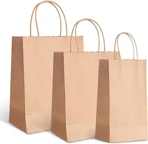 बेकिंग के लिए चर्मपत्र पेपर बैग हैंडल के साथ पुनर्नवीनीकरण थोक माल क्राफ्ट शॉपिंग पर्यावरण अनुकूल क्रिसमस उपहार बैग