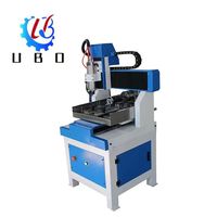Mini machine CNC à cadre en fonte de fer robuste avec axe rotatif bois Mdf contreplaqué acrylique routeur CNC de bureau 4040 pour les entreprises