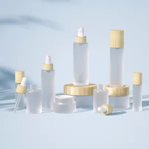 Envase cosmético de bambú 30ml 50ml 100mL 4oz botellas de vidrio de aceite de suero esmerilado botella de bomba tarro de crema facial con tapa de Bambú