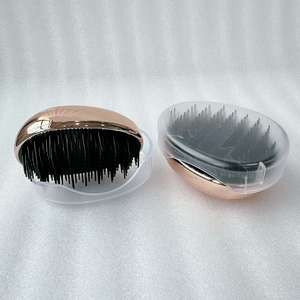 Cepillo de pelo en forma de huevo Peine desenredante de plástico Cabeza Masaje del cuero cabelludo Peine Salón Ducha Herramientas de peinado - Product Image 5